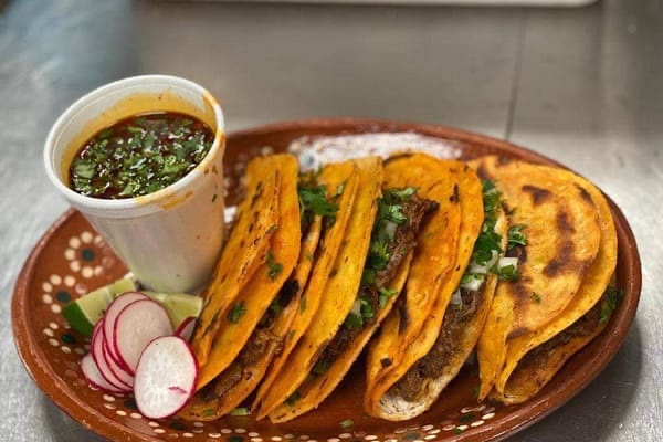 Birria tacos on clay plate
